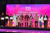 Foto : Pj. Walikota Malang, Iwan Kurniawan , S.T., M.M. didampingi Pj. Ketua TP PKK Kota Malang, Septiana Iwan Kurniawan saat gelaran Grand Final Kakang Mbakyu Kota Malang 2024