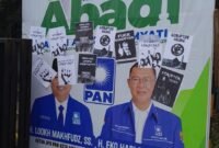 Foto : Poster provokasi yang ditempel di benaner paslon ABADI