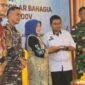 Ket foto. Wakil Bupati Malang, Lathifah Shohib saat menerima tumpeng peresmian SPPG di Kecamatan Kalipare