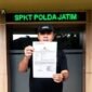 M. Widhi Dhatu Saat Melapor Ke Polda Jatim