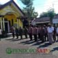 Kapolsek Gambiran, AKP Dwi Wijayanto memimpin apel kesiapsiagaan bersama TNI, Polri, Satpol PP, Linmas, serta panitia penyelenggara parade sound horeg (Foto: Boby pendoposatu.id)